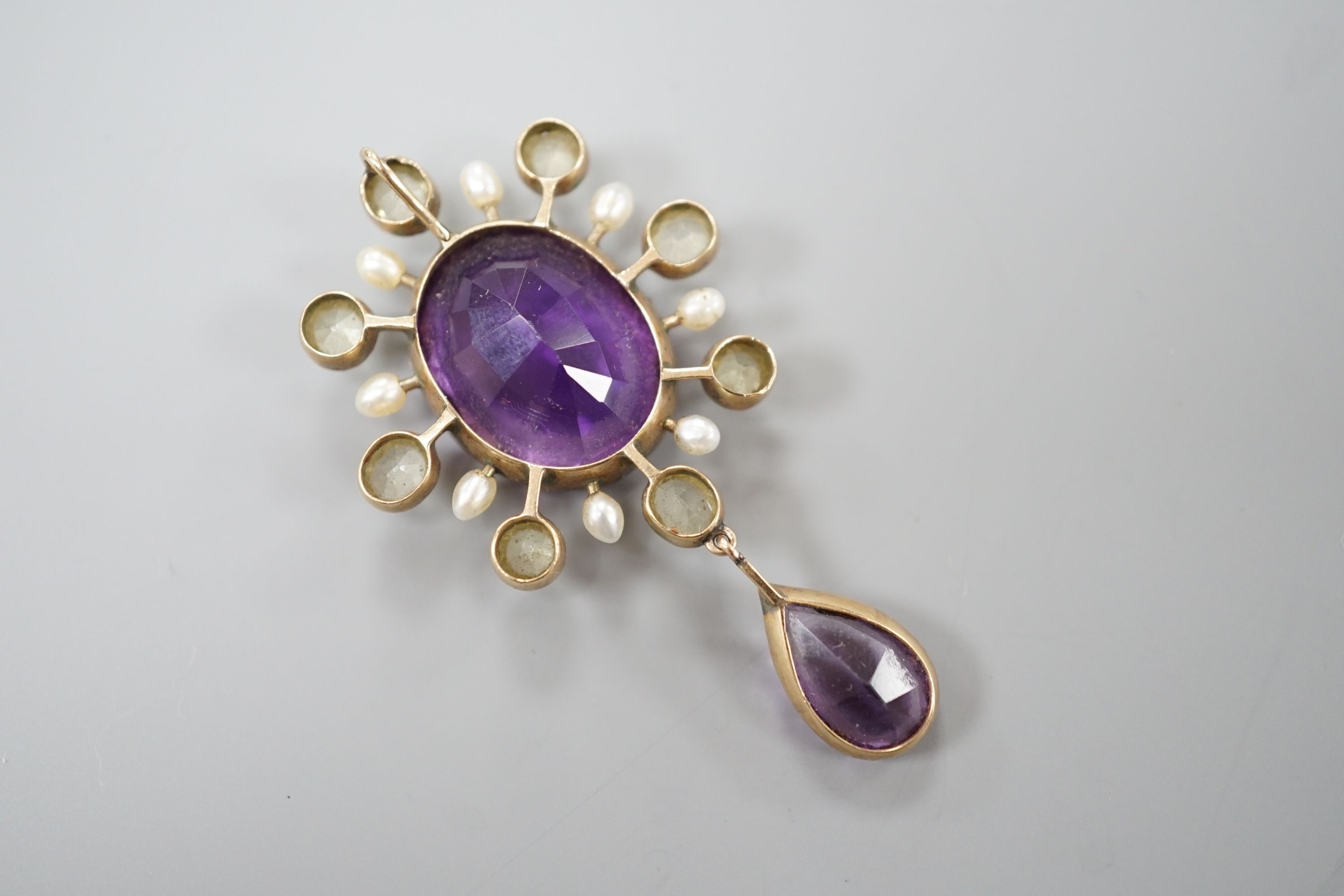 An early 20th century yellow metal, amethyst, olivine, and baroque pearl set drop pendant, 47mm, gross weight 5.4 grams.